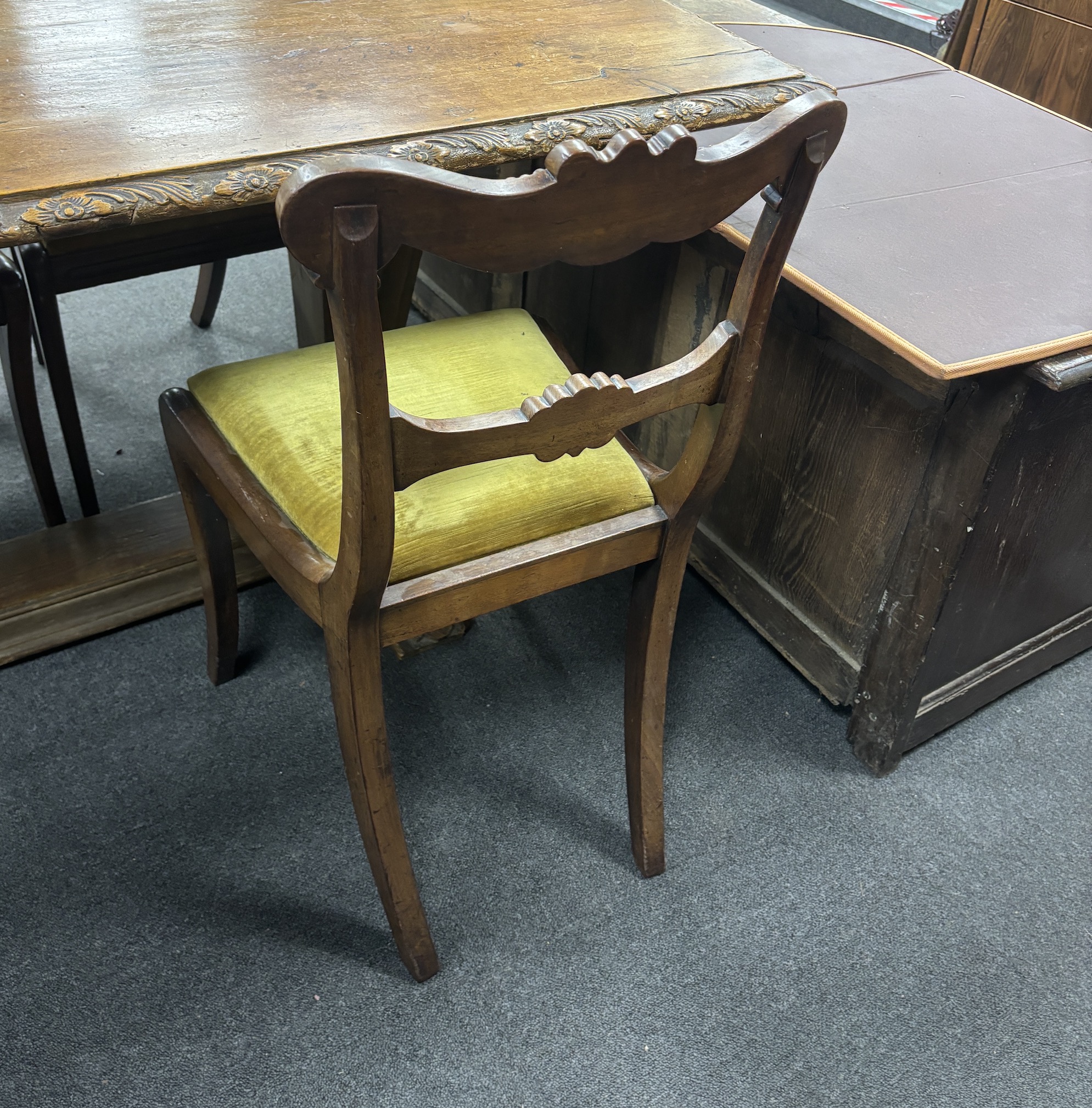 A set of six Regency mahogany sabre leg dining chairs